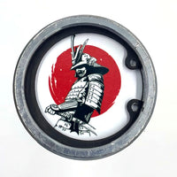 Miyamoto Musashi The Lone Samurai barbell end caps attached to the end of a Rogue Fitness barbell