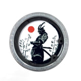 Blood Moon Yasuke the Black Samurai barbellEndCaps attached to the end of a Rogue Fitness barbell.